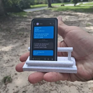 Airphone1 business card holder holding an Airphone1 business card designed to look like a phone text message thread
