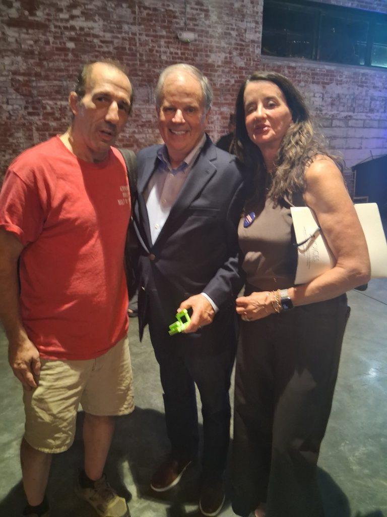 Joe Mastroianni with former Senator Doug Jones holding an Airphone1 phone stand
